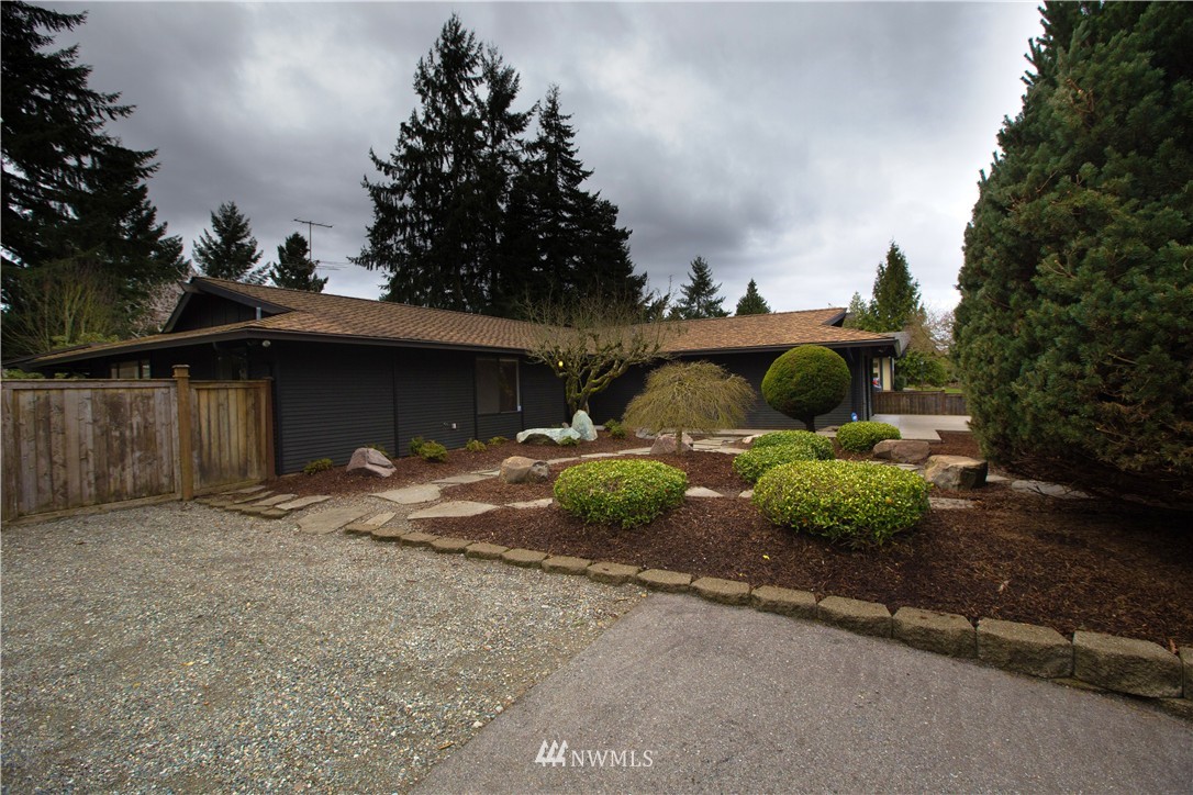 4601 Northeast 24th Street Renton, WA 98059 - Photo 3 of 25 a view of a house with a yard and garage