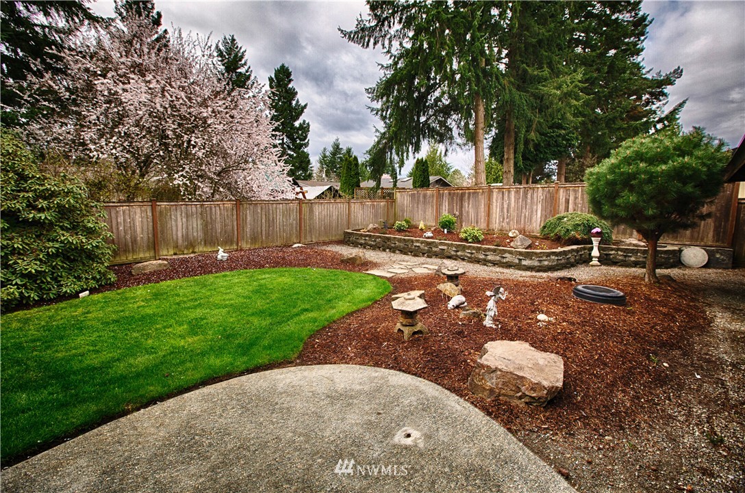 4601 Northeast 24th Street Renton, WA 98059 - Photo 22 of 25 a view of a backyard with green space