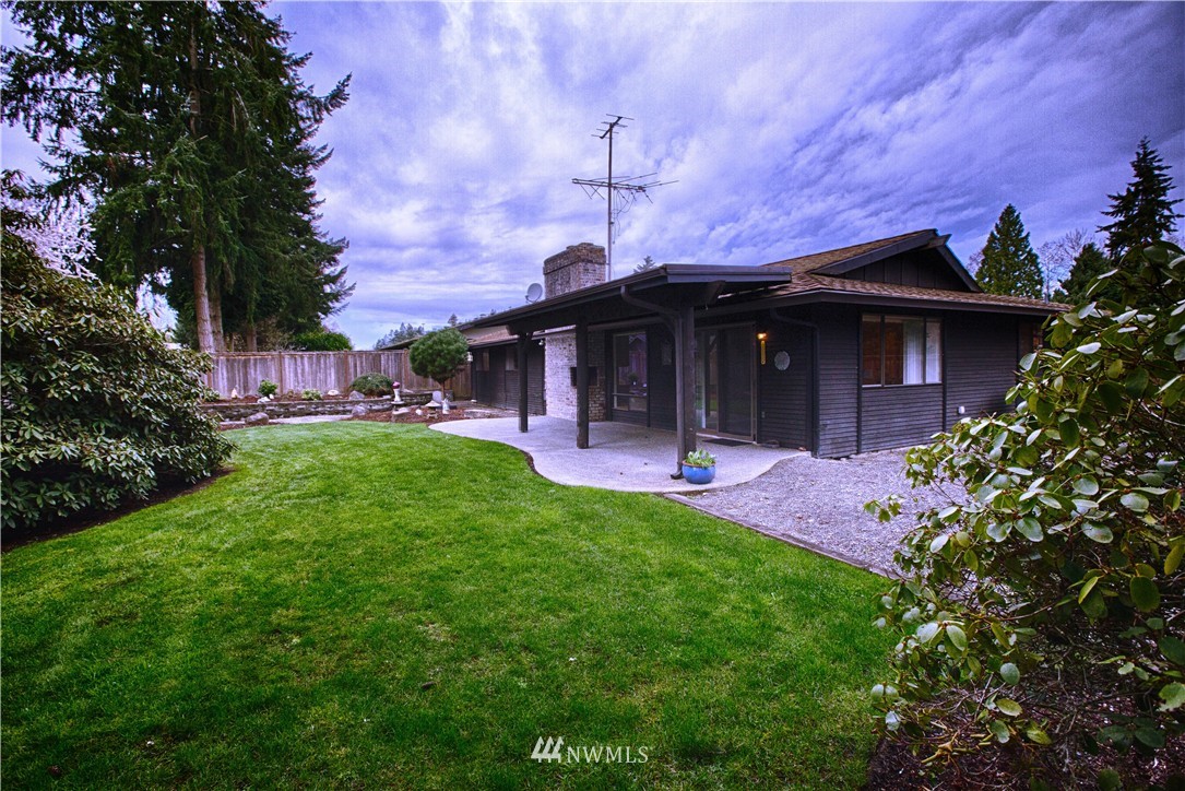 4601 Northeast 24th Street Renton, WA 98059 - Photo 24 of 25 a view of a house with a yard and potted plants