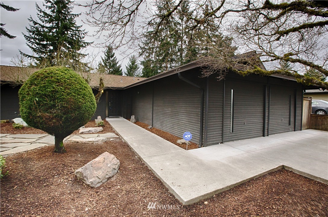 4601 Northeast 24th Street Renton, WA 98059 - Photo 5 of 25 a front view of a house with garden