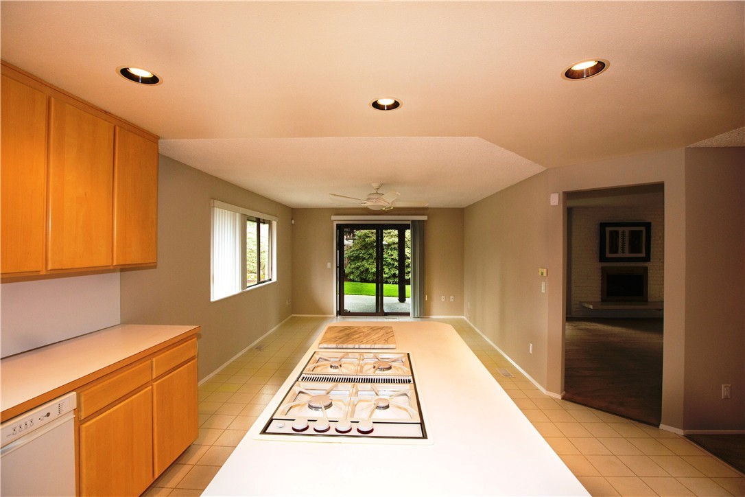 4601 Northeast 24th Street Renton, WA 98059 - Photo 9 of 25 a view of a hallway to an empty room with windows