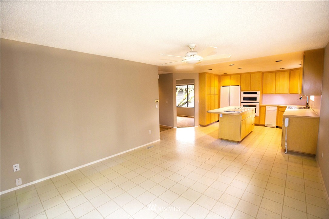 4601 Northeast 24th Street Renton, WA 98059 - Photo 10 of 25 a view of a kitchen with furniture and an empty room
