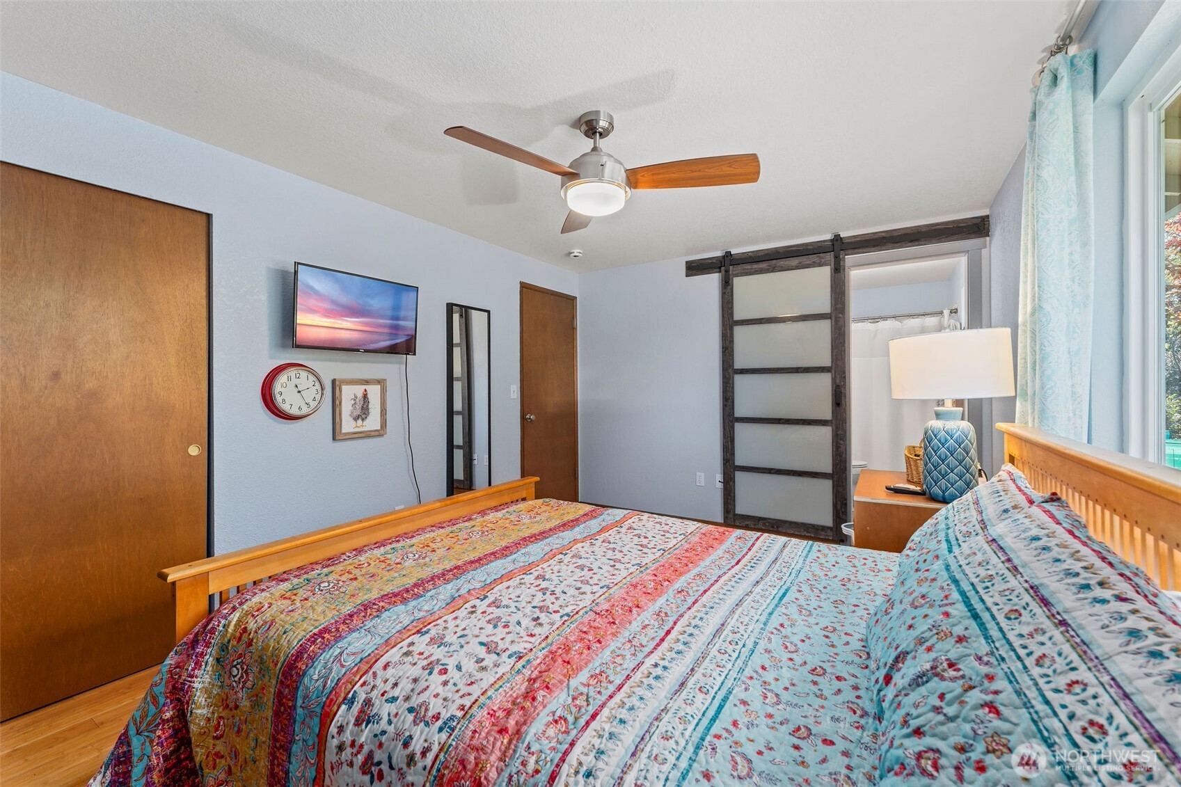 4405 Royal Court Carnation, WA 98014 - Photo 16 of 34 a bedroom with a bed and a lamp on dresser