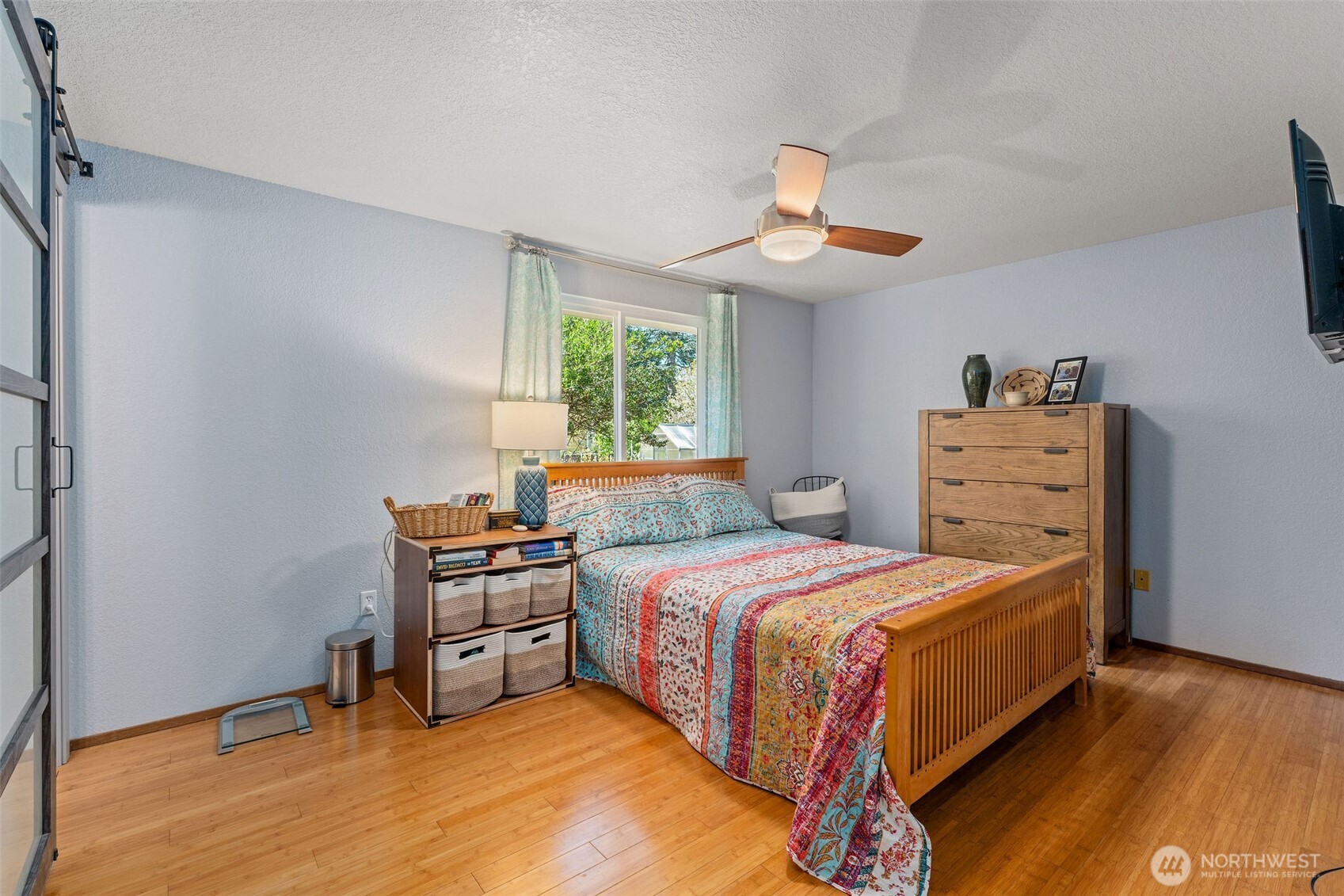 4405 Royal Court Carnation, WA 98014 - Photo 17 of 34 a bedroom with a bed and a chandelier