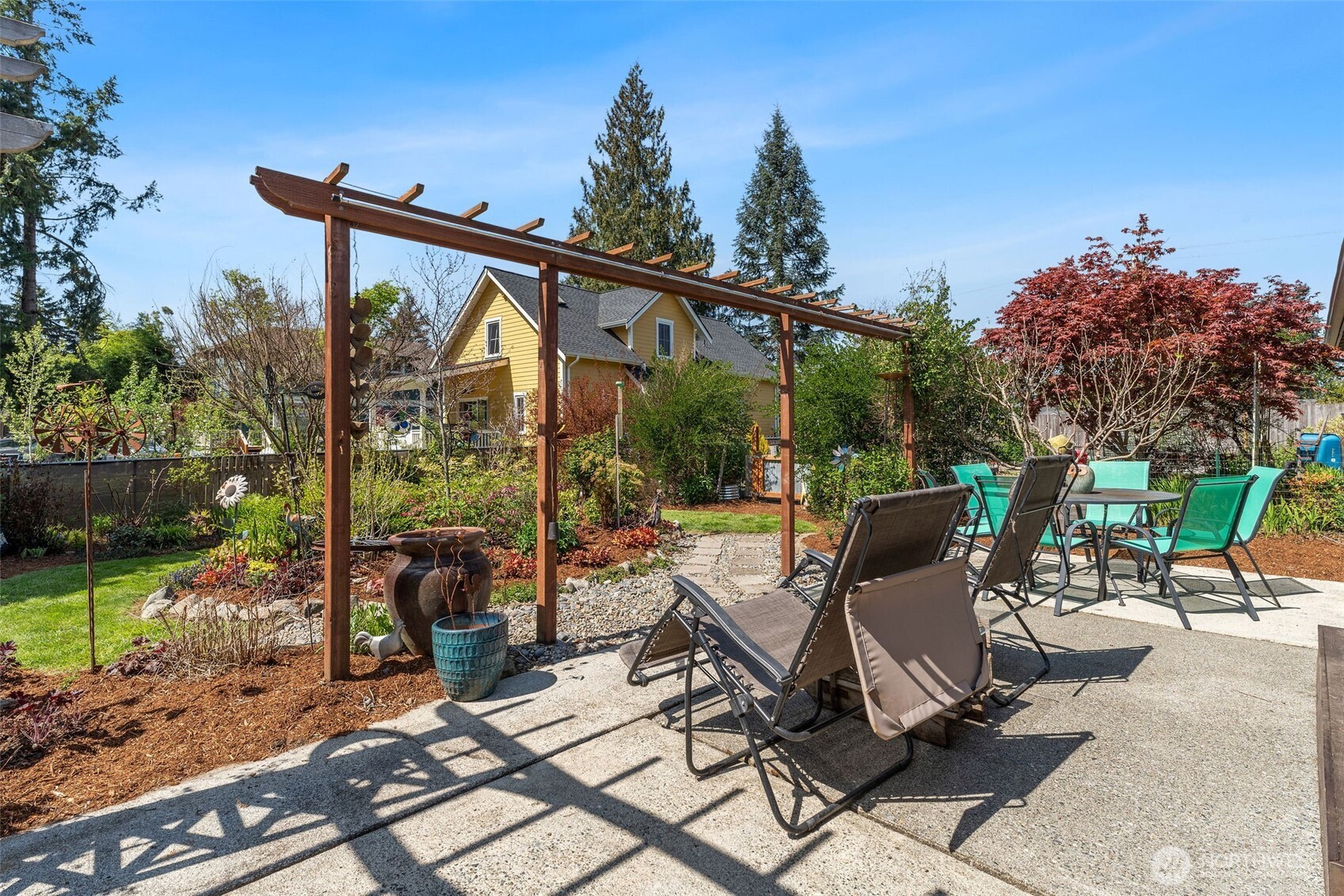 4405 Royal Court Carnation, WA 98014 - Photo 22 of 34 a view of a patio with a table chairs and a backyard