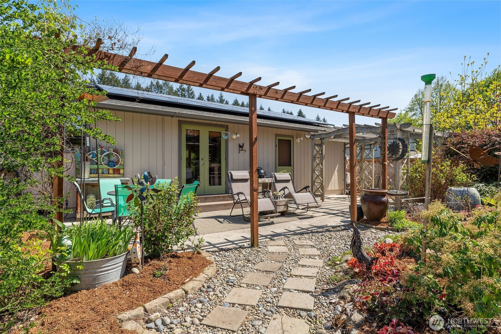 4405 Royal Court Carnation, WA 98014 - Photo 24 of 34 a view of a house with backyard sitting area and porch