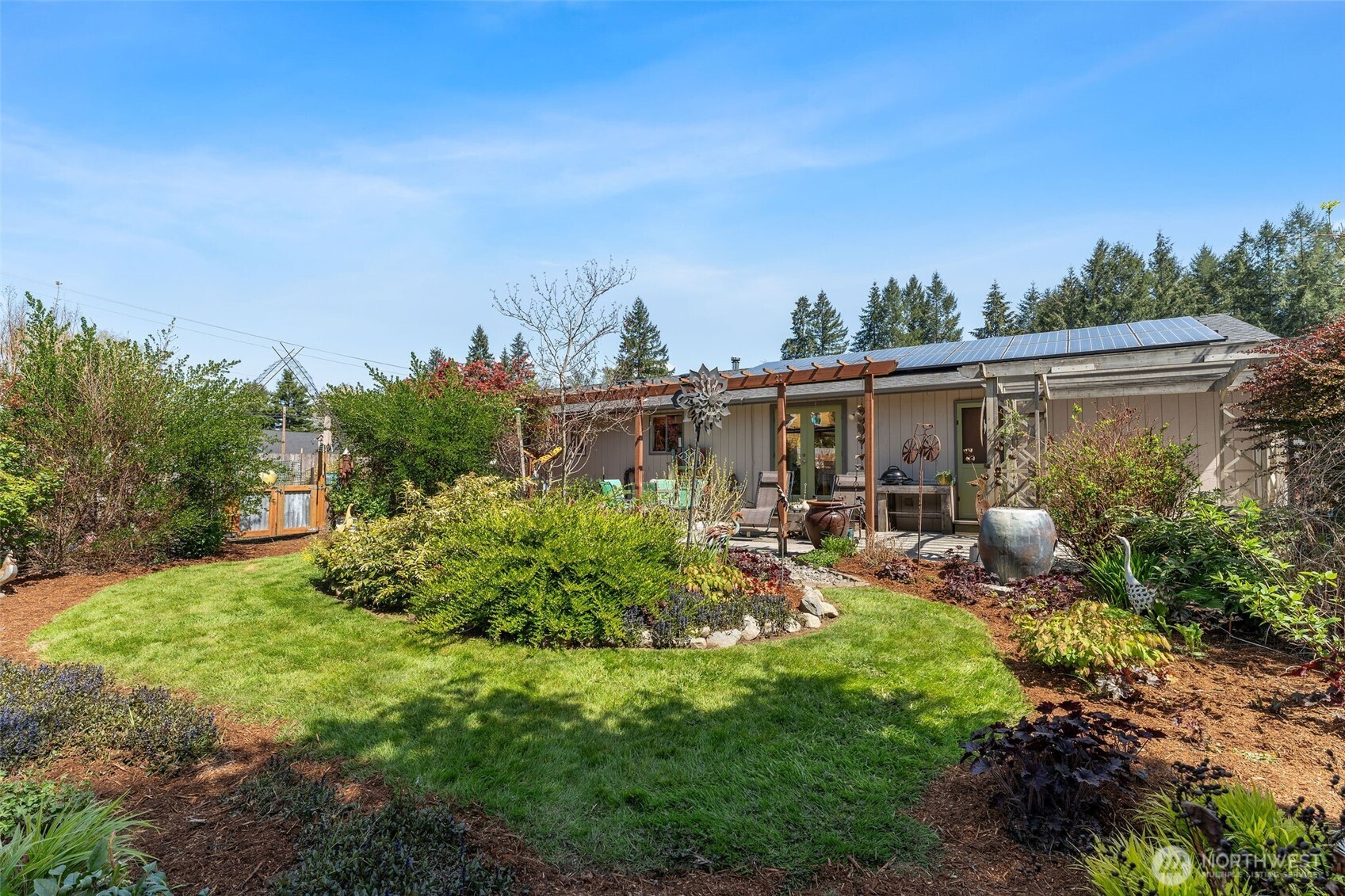 4405 Royal Court Carnation, WA 98014 - Photo 26 of 34 a view of a house with backyard sitting area and garden