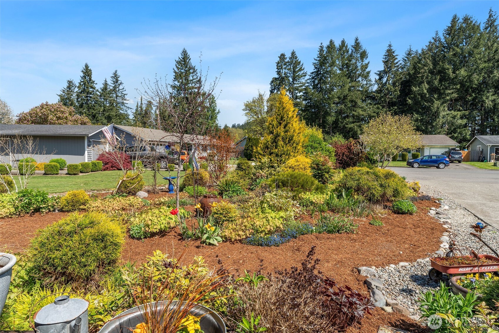 4405 Royal Court Carnation, WA 98014 - Photo 4 of 34 a view of a garden with a fountain