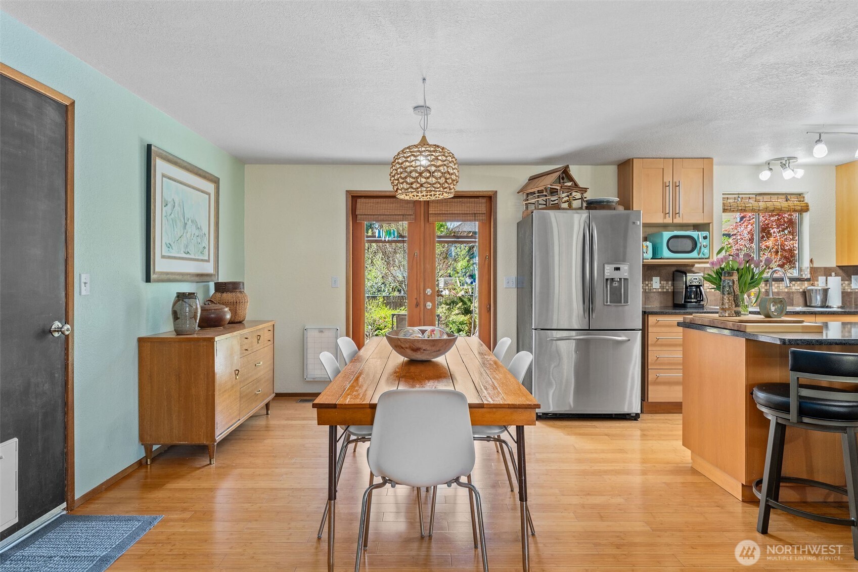 4405 Royal Court Carnation, WA 98014 - Photo 7 of 34 a dining room with furniture a chandelier and wooden floor
