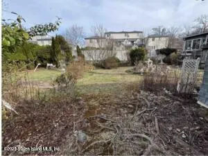 a view of yard from deck with seating area
