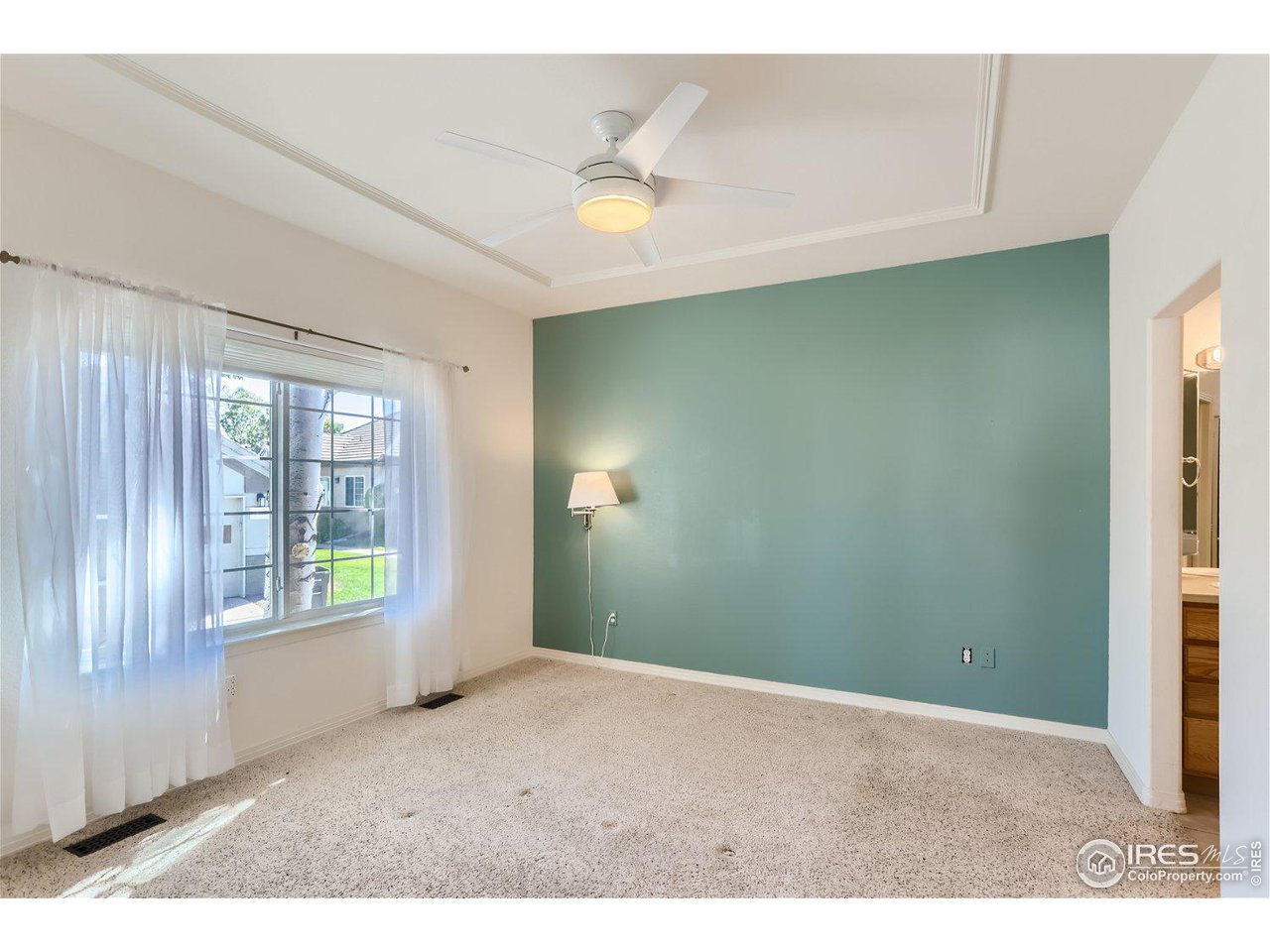 4159 Da Vinci Drive Longmont, CO 80503 - Photo 17 of 32 a view of an empty room with a window