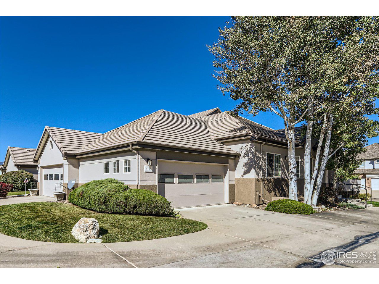 4159 Da Vinci Drive Longmont, CO 80503 - Photo 3 of 32 a front view of a house with a yard