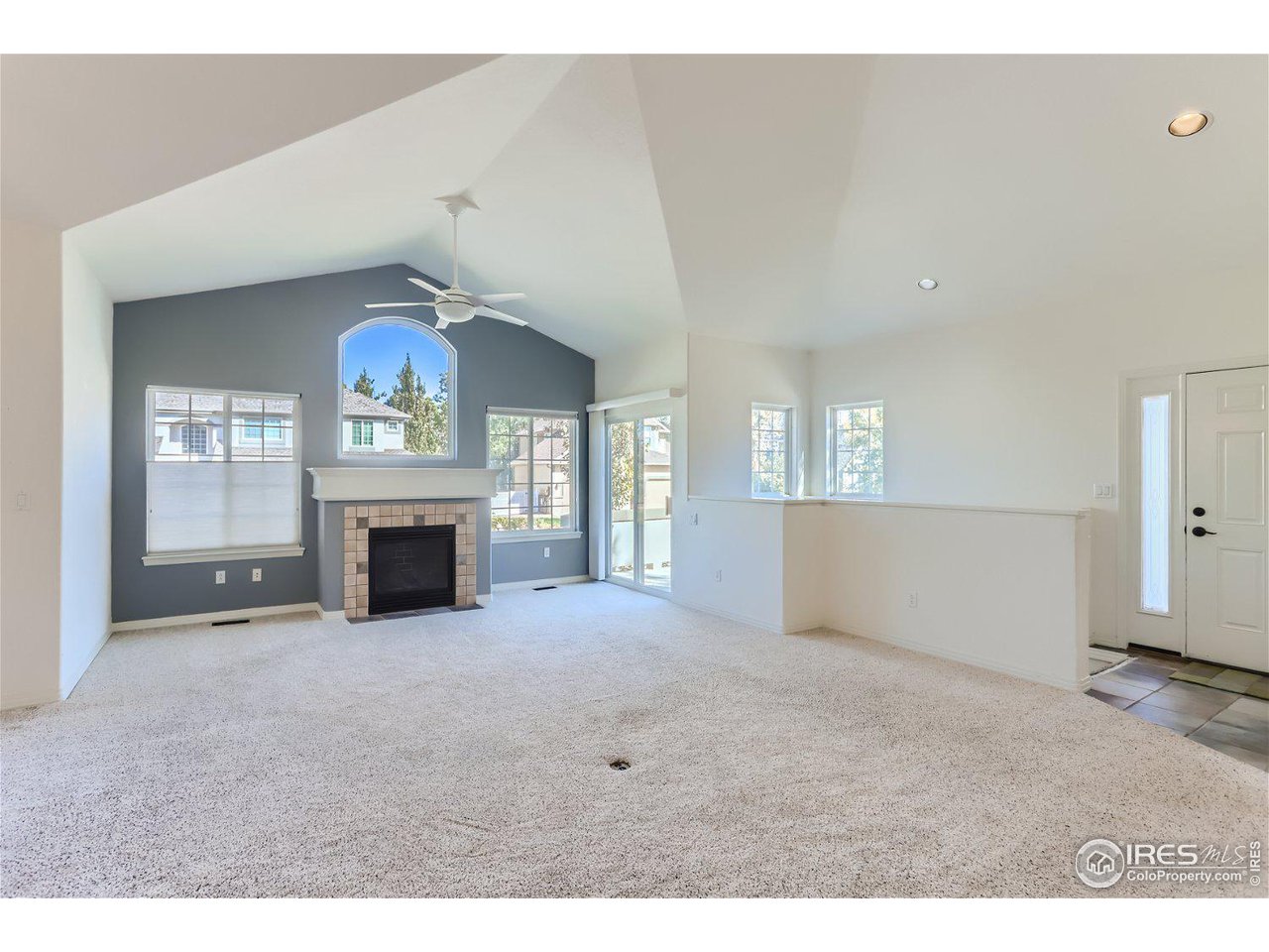 4159 Da Vinci Drive Longmont, CO 80503 - Photo 6 of 32 a view of an empty room with a fireplace