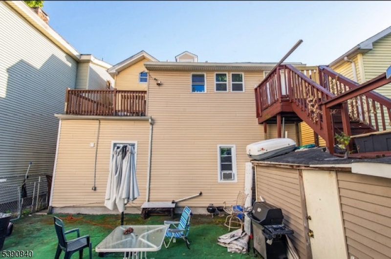377-379 Ellison Street Paterson, NJ 07501 - Photo 12 of 28 a view of a house with brick walls and stairs