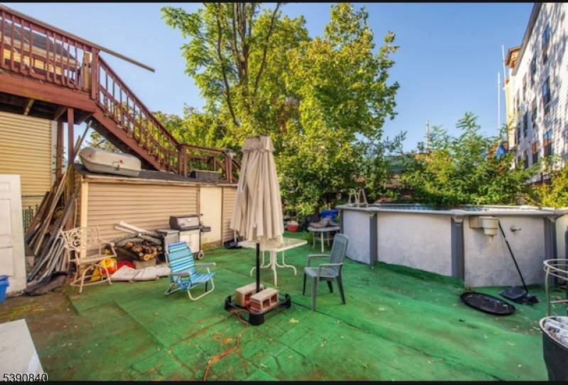 377-379 Ellison Street Paterson, NJ 07501 - Photo 13 of 28 a view of backyard with sitting area