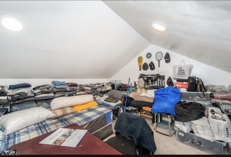 377-379 Ellison Street Paterson, NJ 07501 - Photo 17 of 28 a living room with furniture and wooden floor