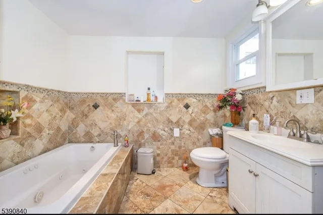 a bathroom with a sink a toilet and a bathtub