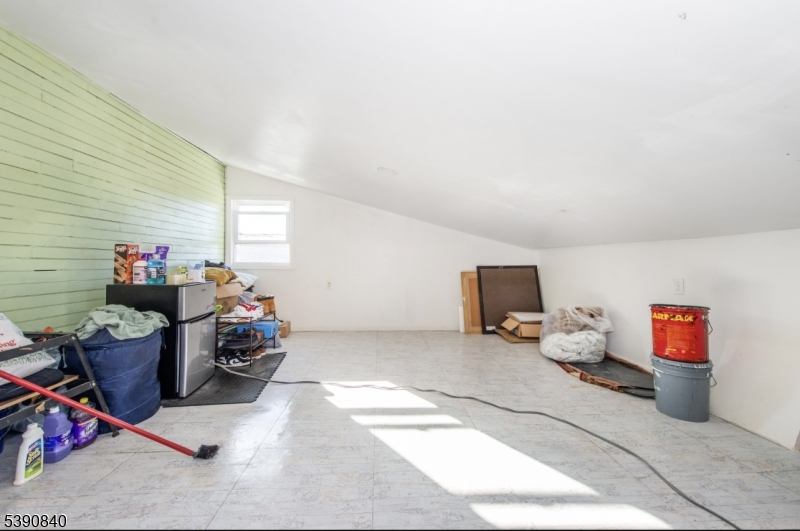 377-379 Ellison Street Paterson, NJ 07501 - Photo 22 of 28 a living room with furniture and a flat screen tv