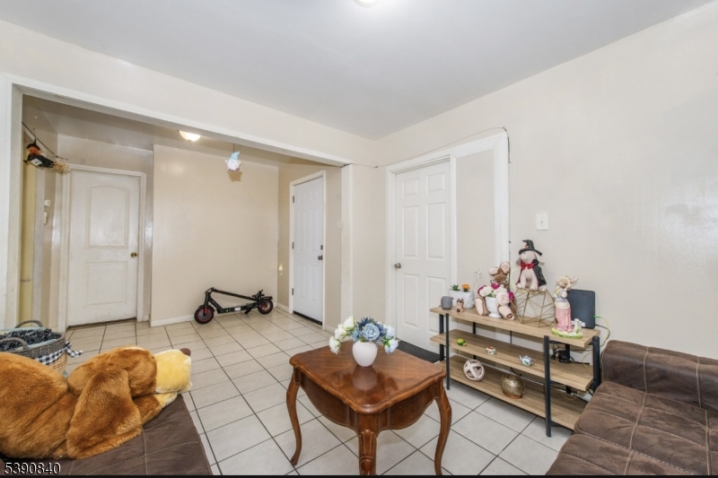 377-379 Ellison Street Paterson, NJ 07501 - Photo 6 of 28 a living room with furniture
