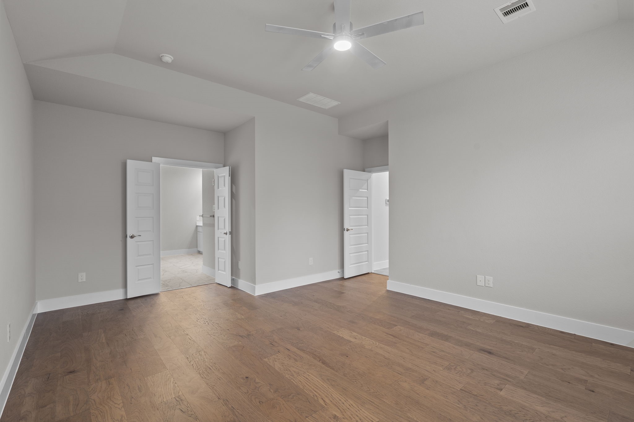 2116 Golden Spruce Court Conroe, TX 77301 - Photo 16 of 28 wooden floor in an empty room