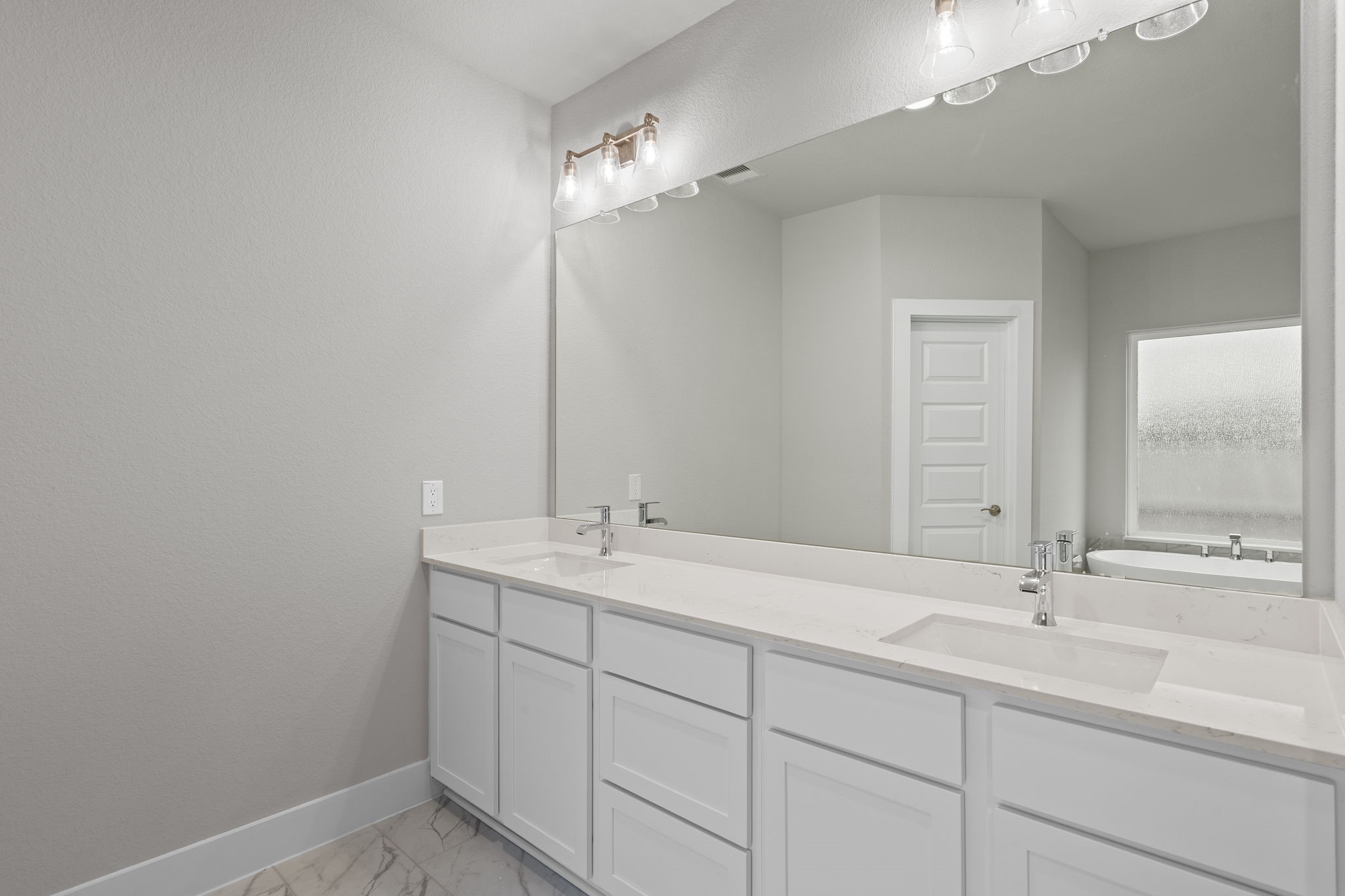 2116 Golden Spruce Court Conroe, TX 77301 - Photo 18 of 28 a bathroom with a sink and a mirror