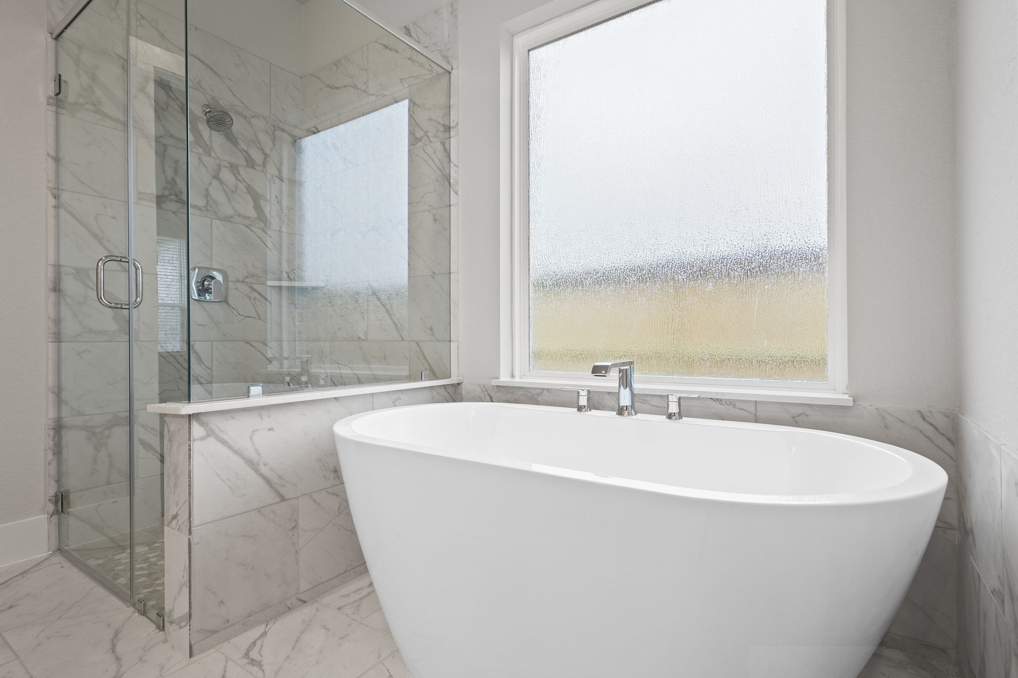 2116 Golden Spruce Court Conroe, TX 77301 - Photo 19 of 28 a spacious bathroom with sink and shower