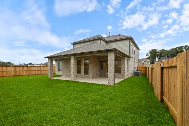 a view of a house with backyard porch and garden