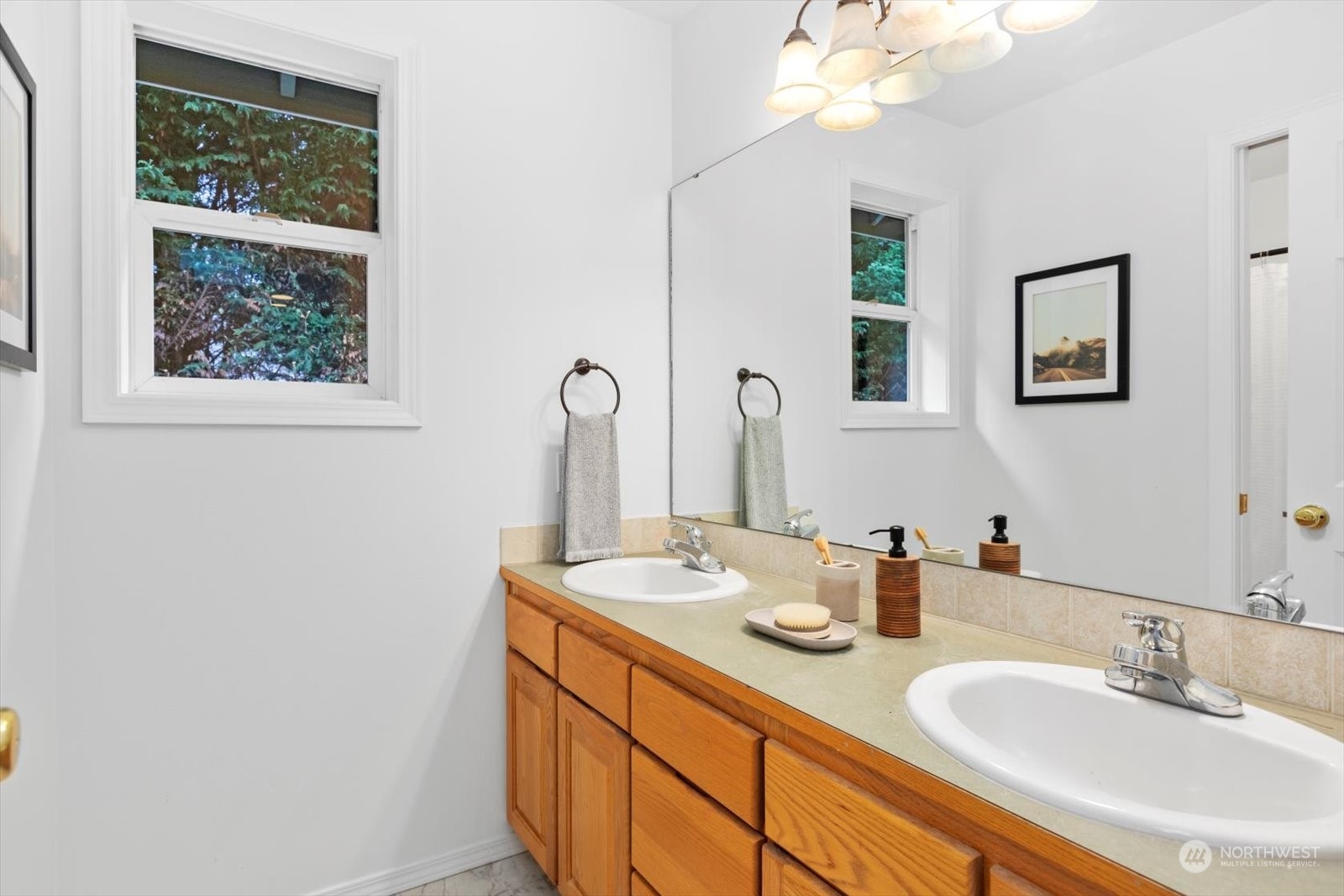 22920 53rd Avenue Southeast Bothell, WA 98021 - Photo 24 of 40 a bathroom with a double vanity sink and a mirror