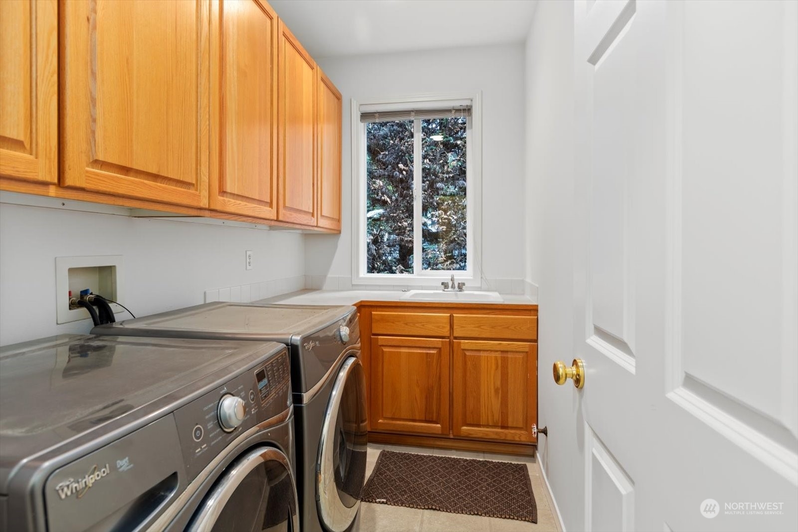 22920 53rd Avenue Southeast Bothell, WA 98021 - Photo 28 of 40 a kitchen with a sink and cabinets