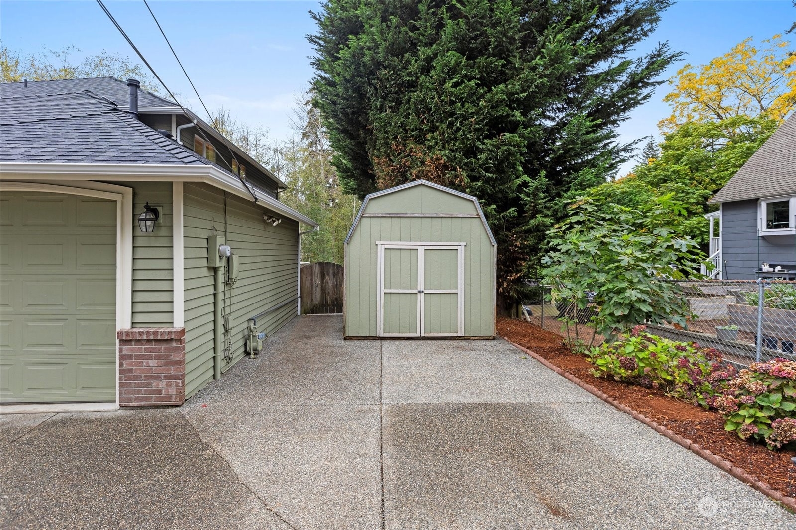22920 53rd Avenue Southeast Bothell, WA 98021 - Photo 31 of 40 a view of a house with a yard and potted plants