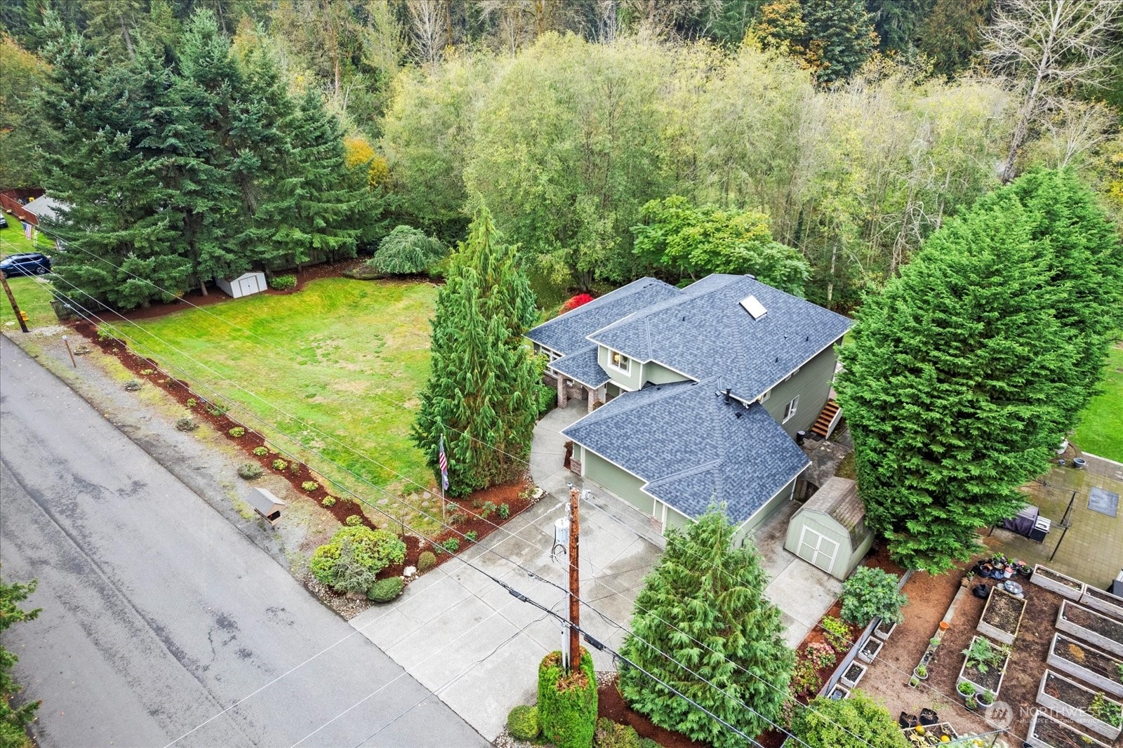 22920 53rd Avenue Southeast Bothell, WA 98021 - Photo 37 of 40 an aerial view of a house with a garden and lake view