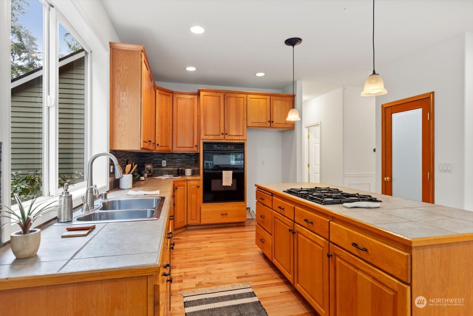 22920 53rd Avenue Southeast Bothell, WA 98021 - Photo 9 of 40 a kitchen with stainless steel appliances granite countertop a sink stove and refrigerator