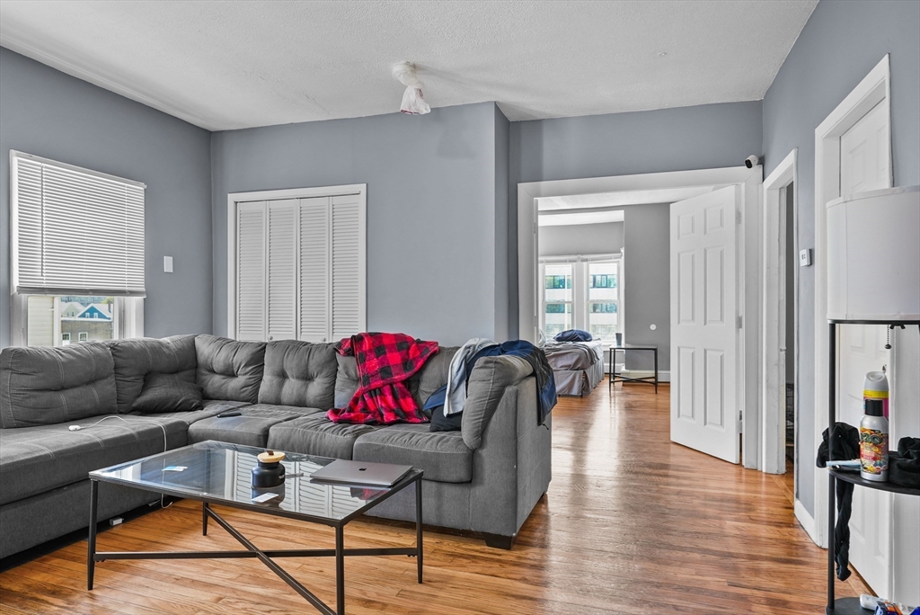 32 Quequechan Street Fall River, MA 02723 - Photo 18 of 34 a living room with furniture and a wooden floor