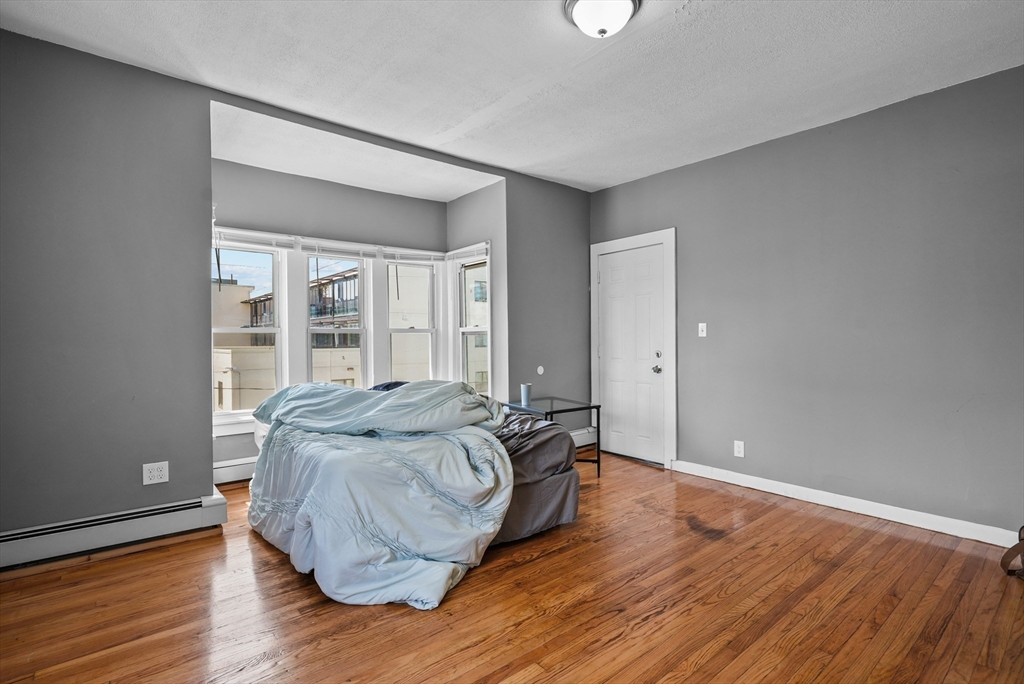 32 Quequechan Street Fall River, MA 02723 - Photo 21 of 34 a living room with furniture and wooden floor