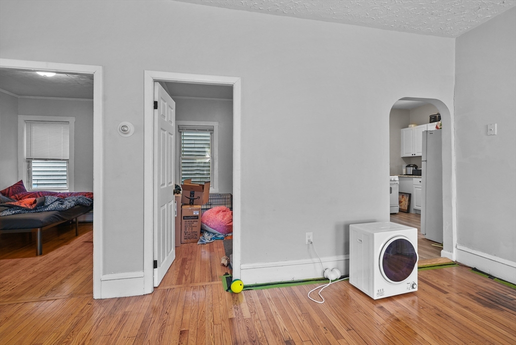 32 Quequechan Street Fall River, MA 02723 - Photo 31 of 34 a view of an empty room and wooden floor