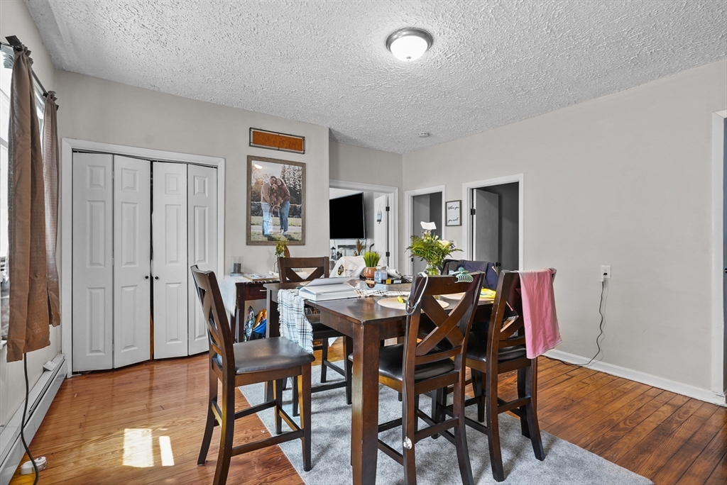 32 Quequechan Street Fall River, MA 02723 - Photo 5 of 34 a view of a dining room with furniture and wooden floor