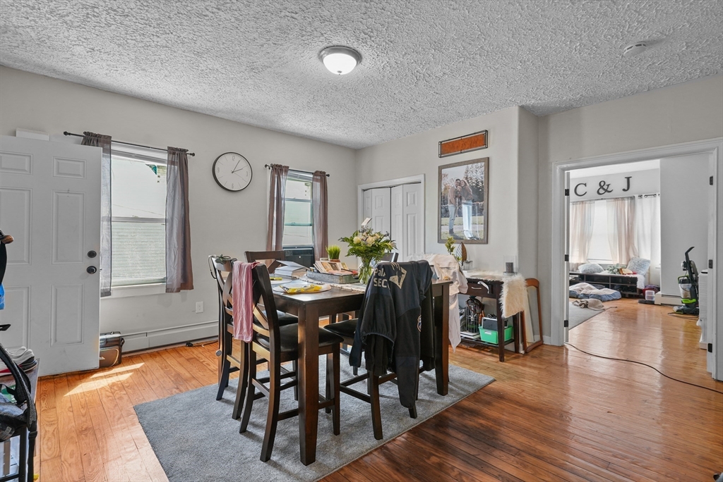 32 Quequechan Street Fall River, MA 02723 - Photo 6 of 34 a view of a a dining room with furniture window and wooden floor