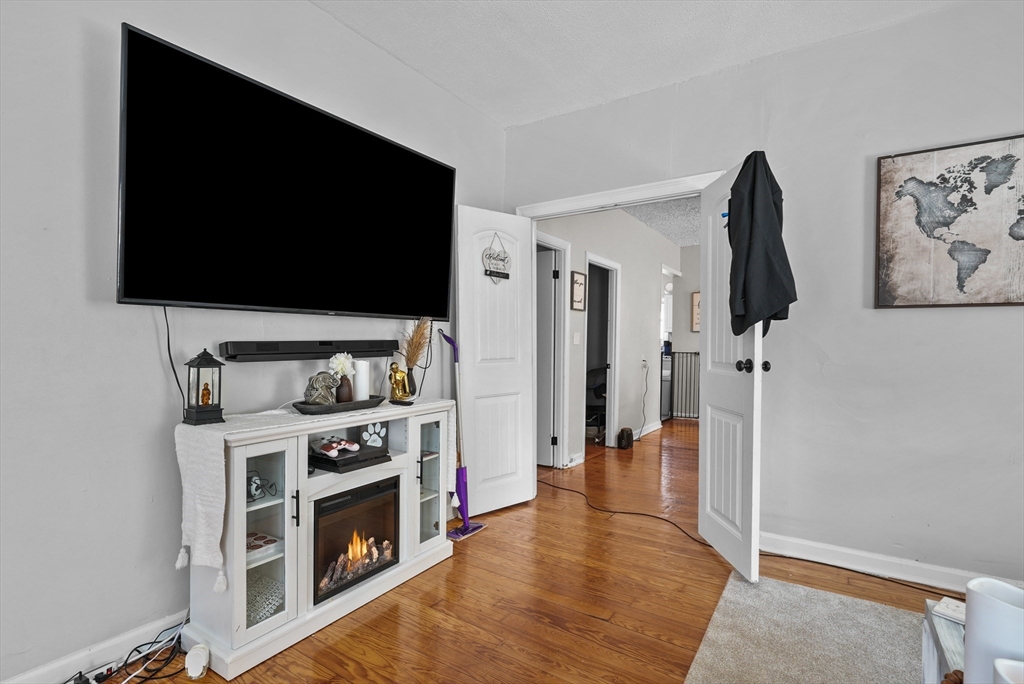 32 Quequechan Street Fall River, MA 02723 - Photo 9 of 34 a view of living room with furniture and flat screen tv
