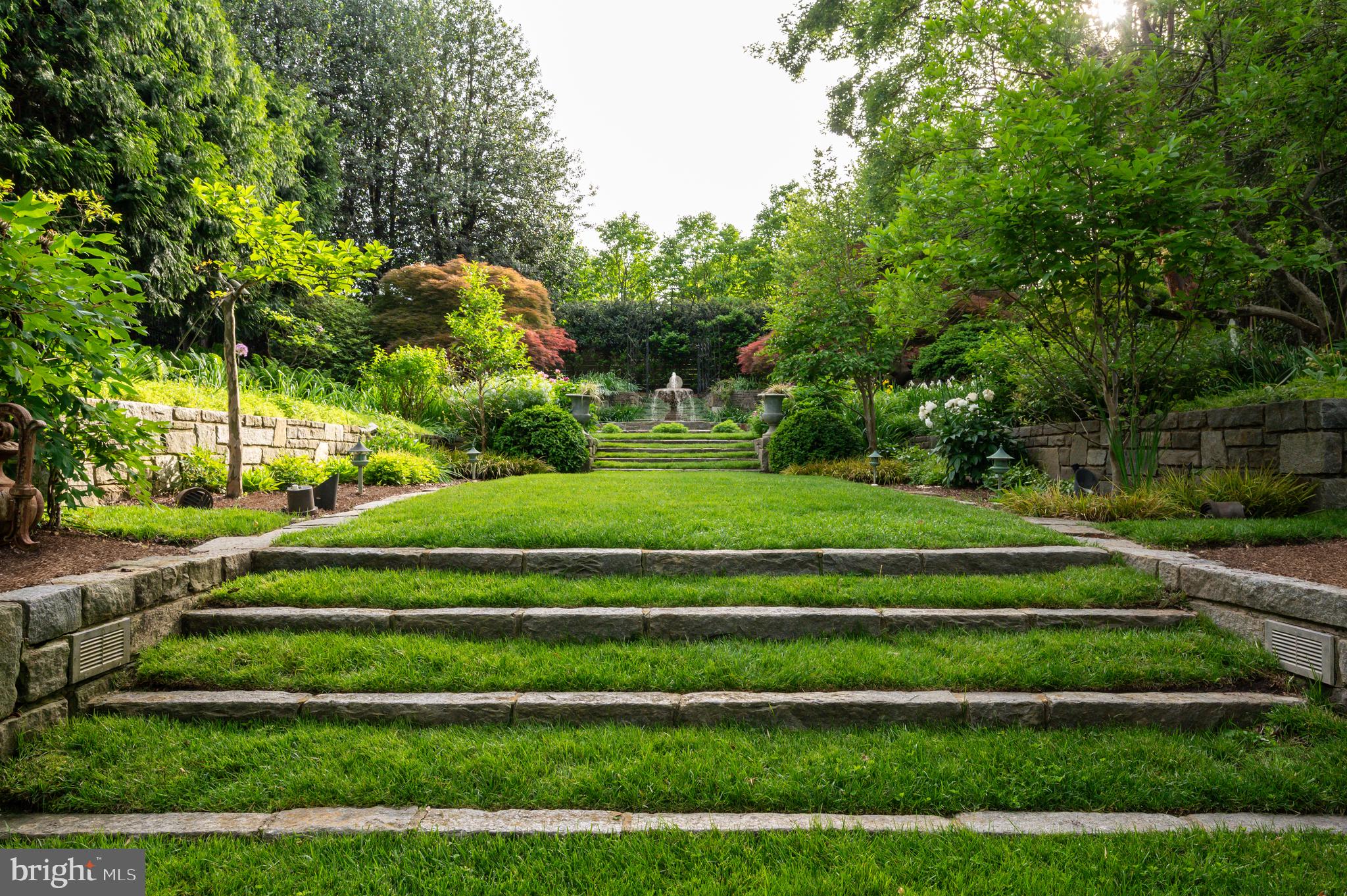 7116 Glenbrook Road Bethesda, MD 20814 - Photo 12 of 30 a green field with lots of trees in the background
