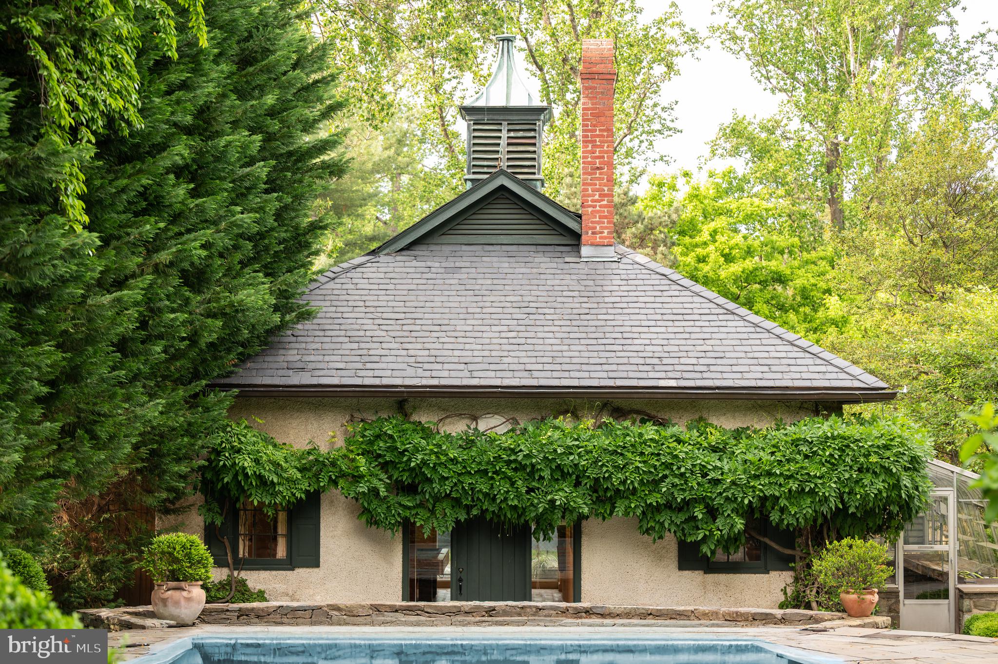 7116 Glenbrook Road Bethesda, MD 20814 - Photo 16 of 30 a house with trees in the background
