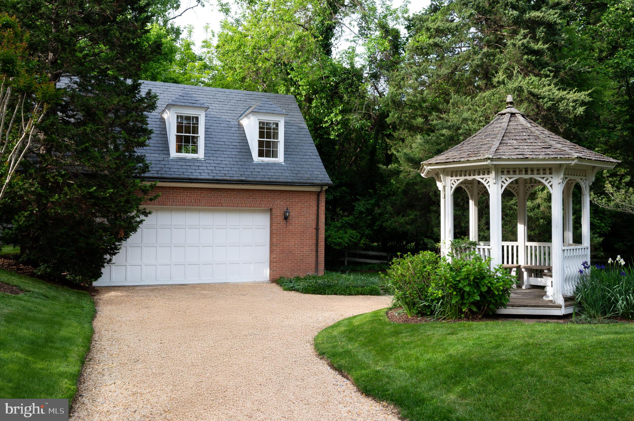 7116 Glenbrook Road Bethesda, MD 20814 - Photo 18 of 30 a front view of a house with a yard