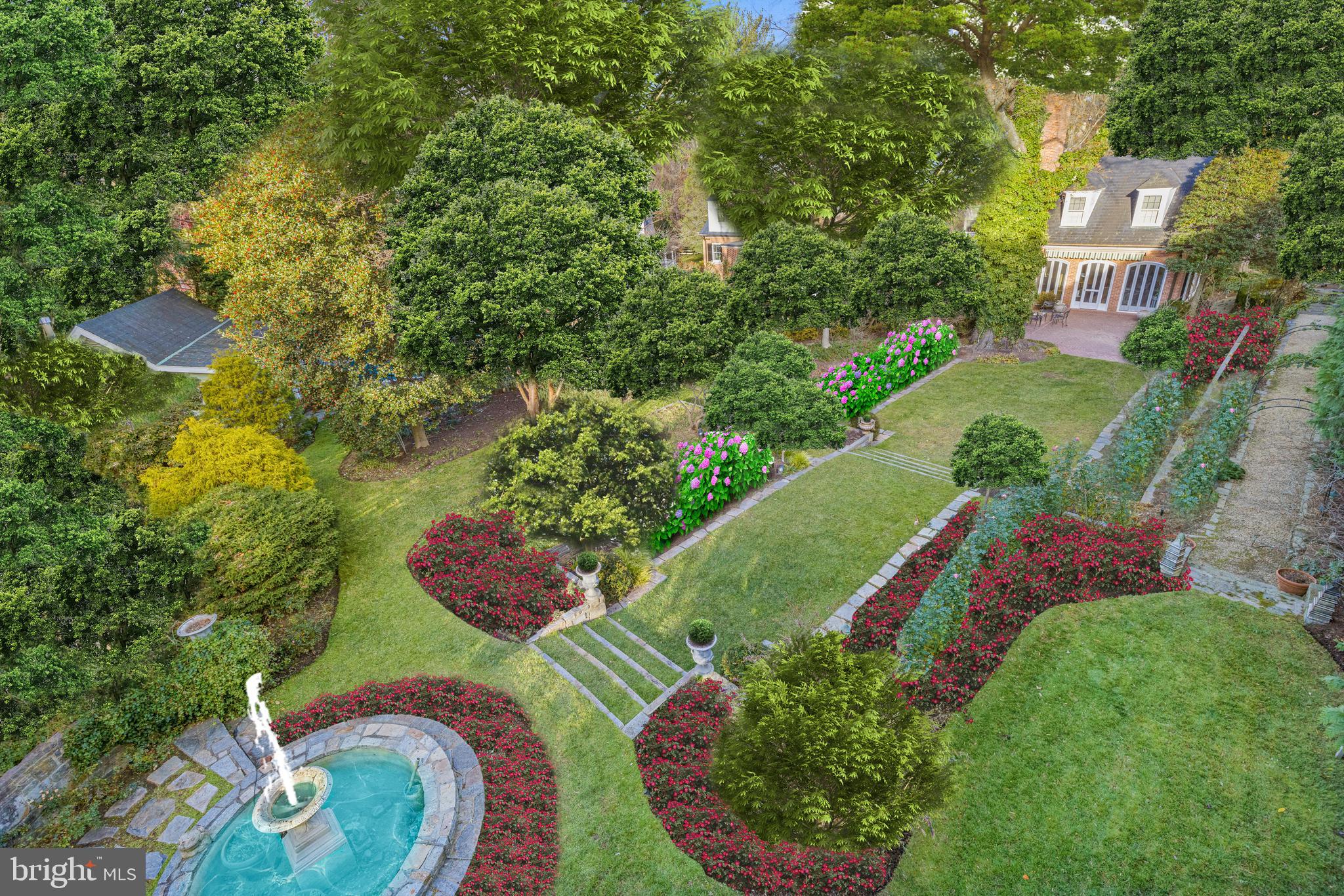 7116 Glenbrook Road Bethesda, MD 20814 - Photo 19 of 30 a view of a house with a yard and plants