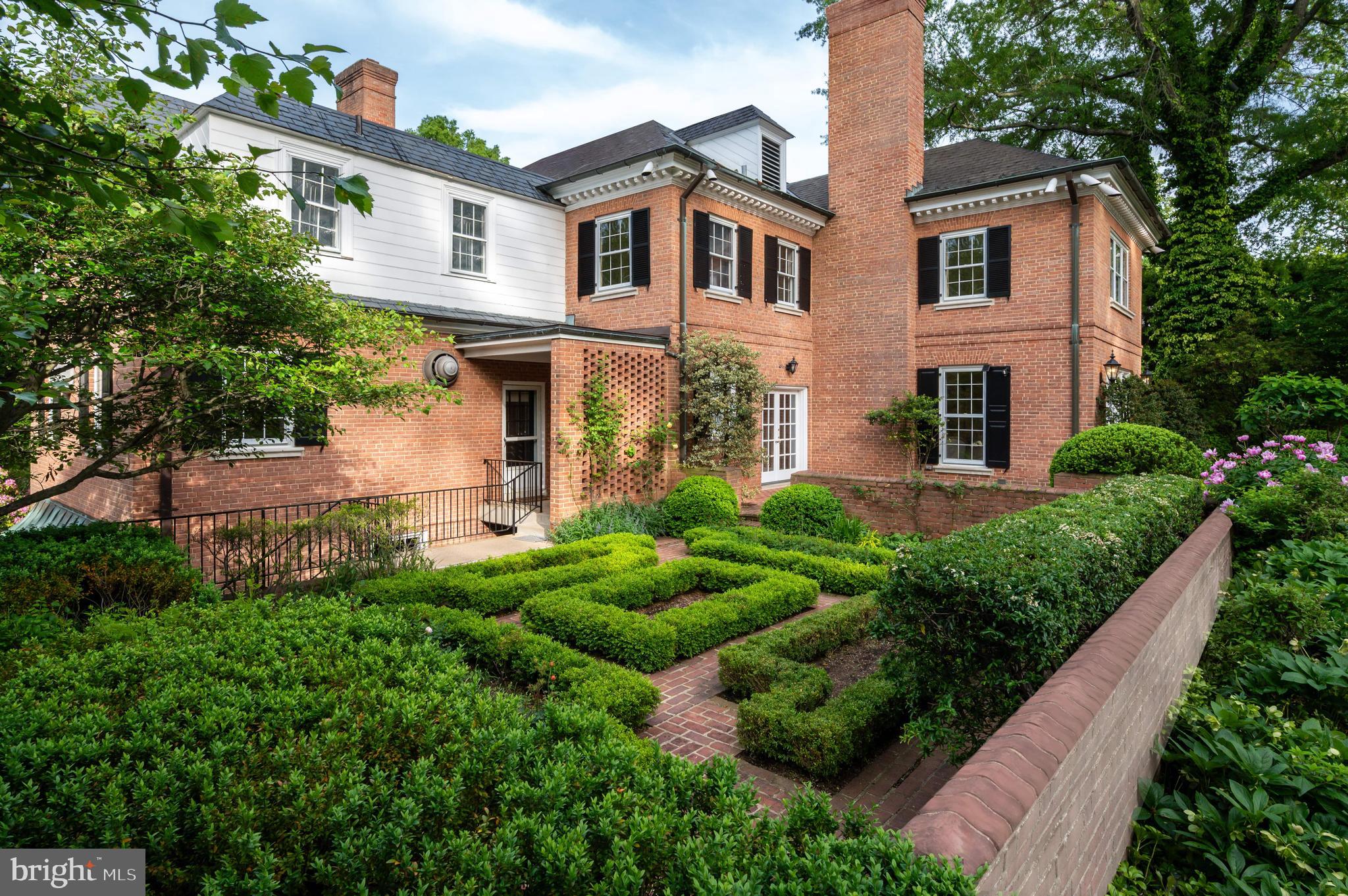 7116 Glenbrook Road Bethesda, MD 20814 - Photo 26 of 30 a front view of a house with garden