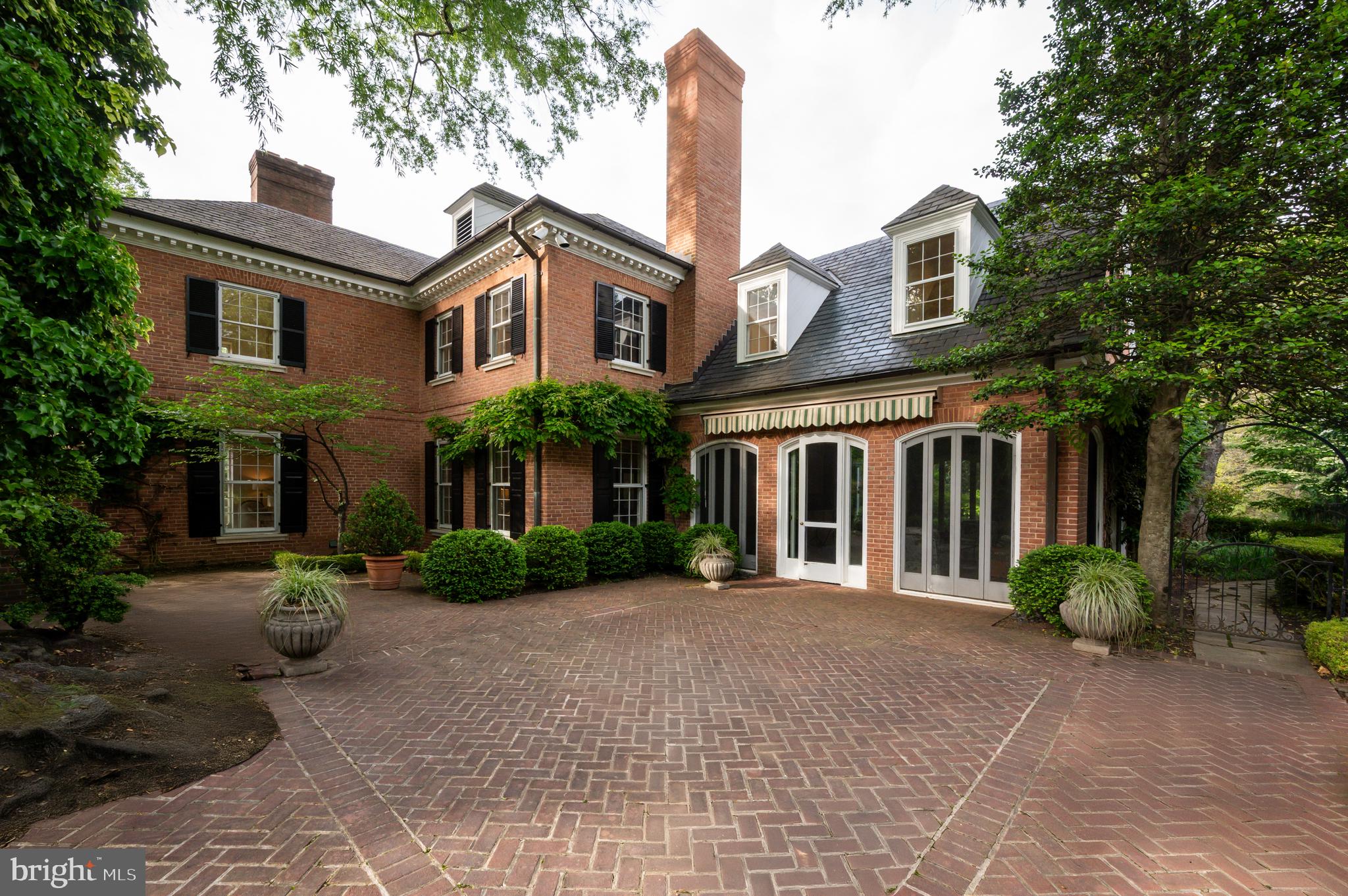 7116 Glenbrook Road Bethesda, MD 20814 - Photo 28 of 30 a front view of a house with garden