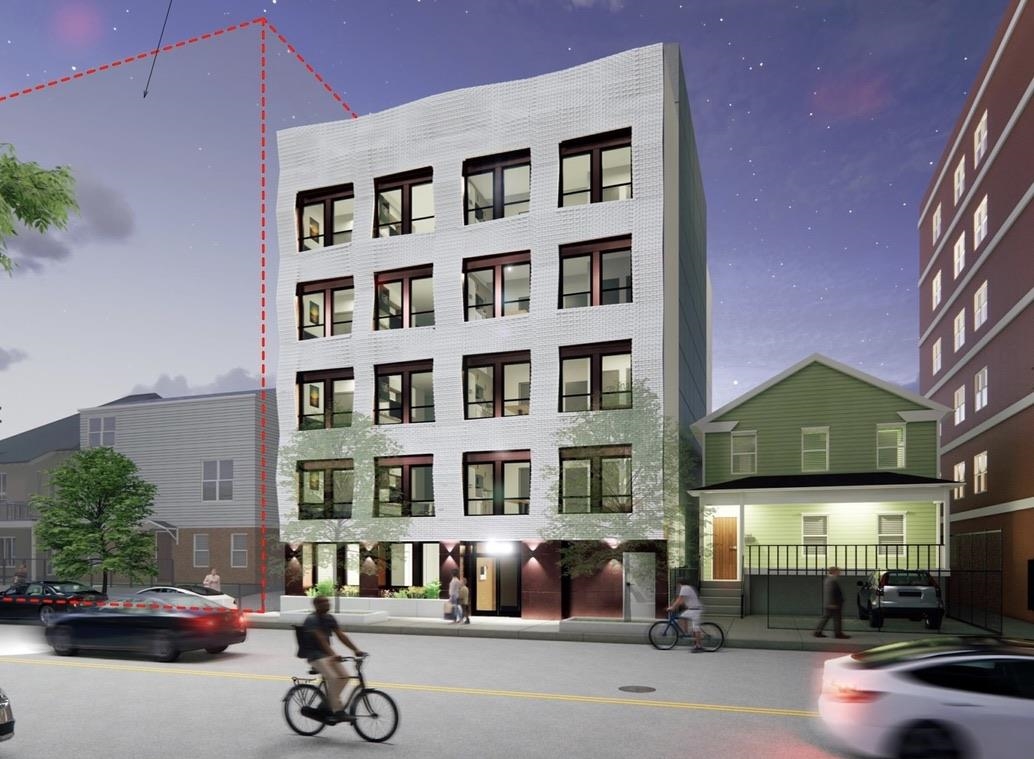 a front view of a building with parked cars