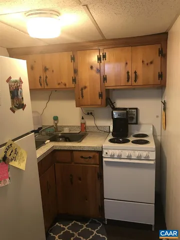 a kitchen with a stove and a sink