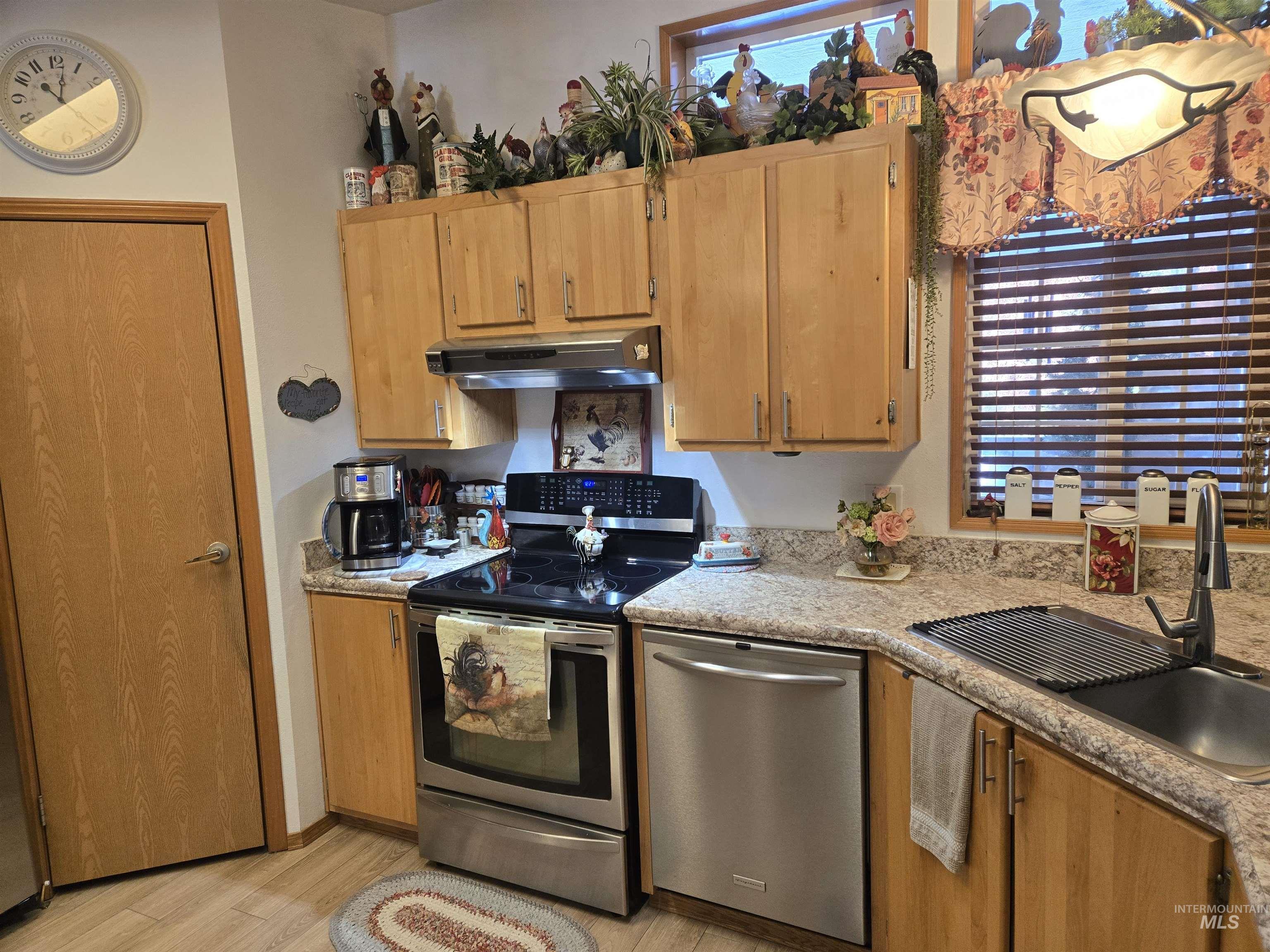 254 Lackey Road Weippe, ID 83553 - Photo 9 of 38 Kitchen with stainless steel appliances and light wood-type flooring