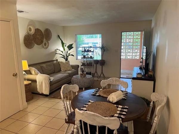 a kitchen with stainless steel appliances a stove a sink and a refrigerator