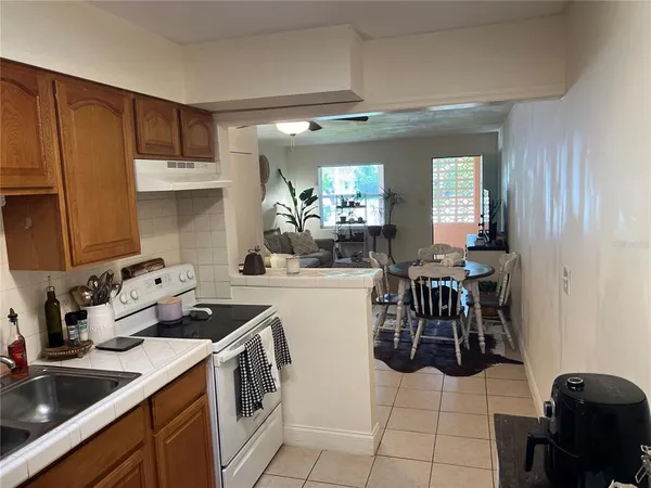 a white toilet sitting next to a bathroom sink and vanity