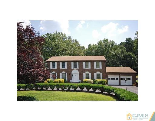87 Bennett Road Old Bridge, NJ 07747 - Photo 1 of 1 a front view of a house with a garden
